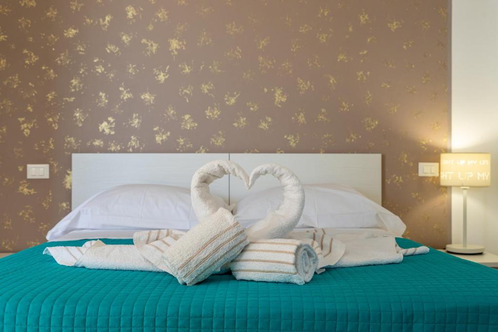 Łóżko lub łóżka w pokoju w obiekcie Saija Apartment