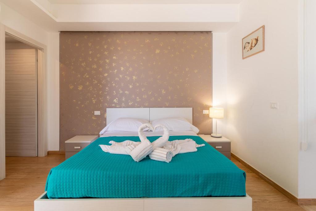 Łóżko lub łóżka w pokoju w obiekcie Saija Apartment