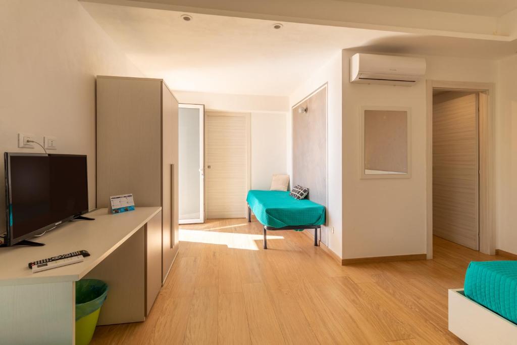 Telewizja i/lub zestaw kina domowego w obiekcie Saija Apartment