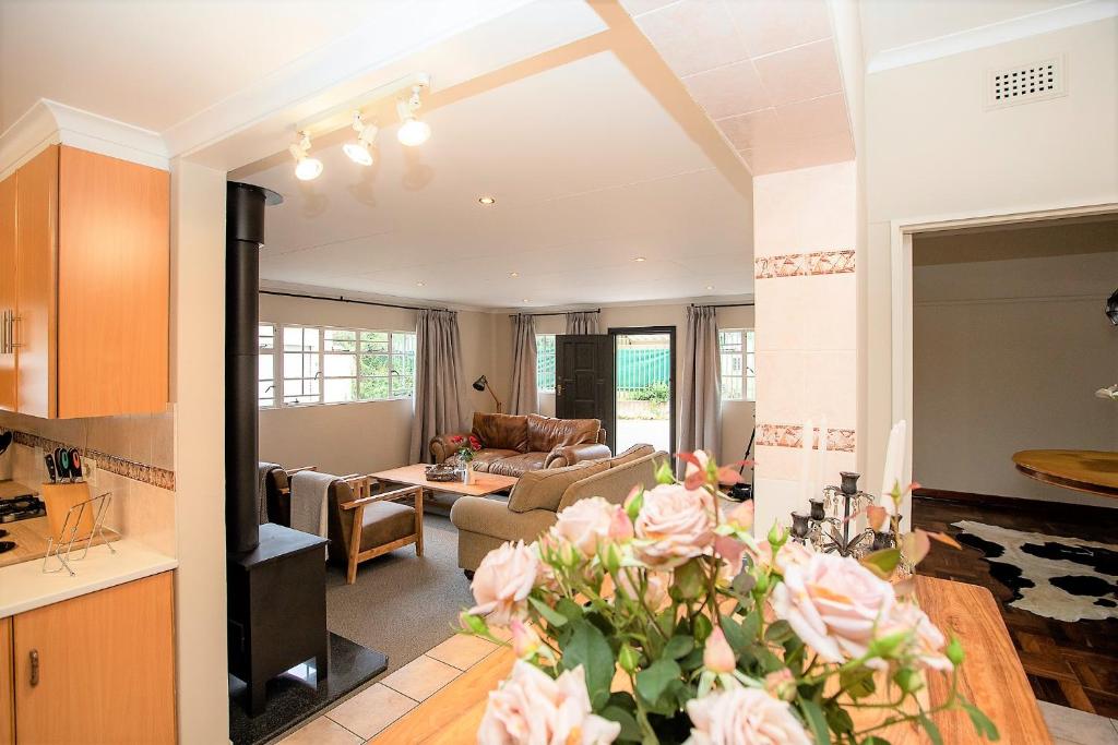 a living room with a couch and a table at #9 Notties Avenue in Nottingham Road