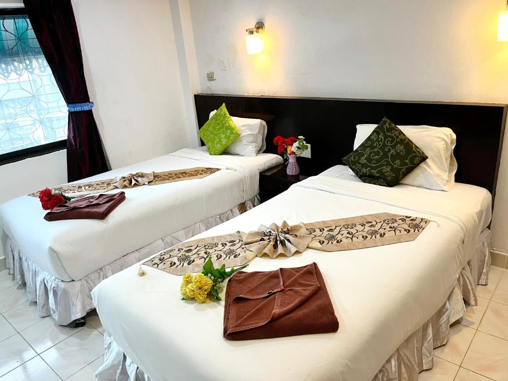 Postel nebo postele na pokoji v ubytování Lamai Apartment