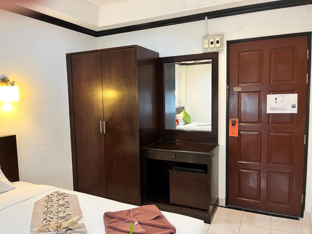 Postel nebo postele na pokoji v ubytování Lamai Apartment