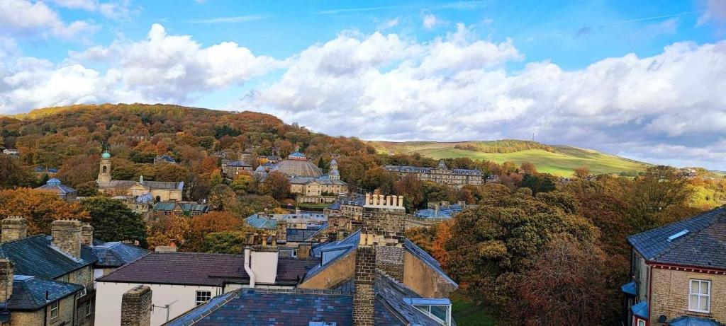 a view of a small town in the hills at Flat 8 Buxton Town centre apartment in Buxton