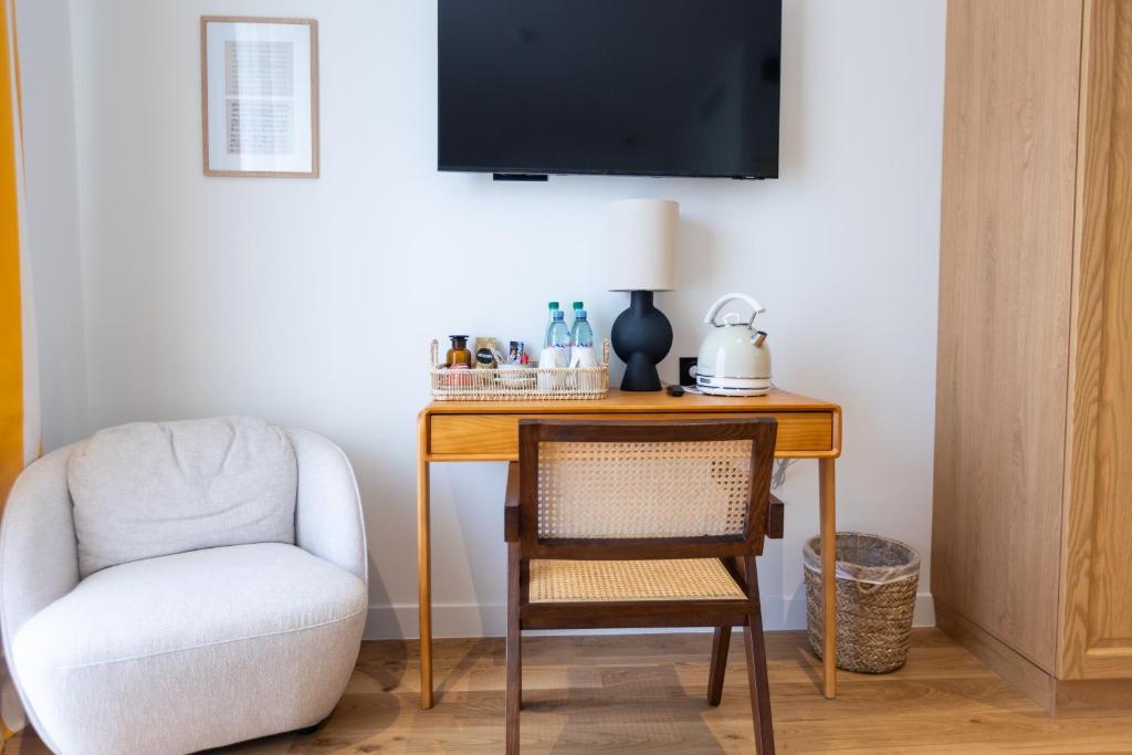TV a/nebo společenská místnost v ubytování Maison Durante
