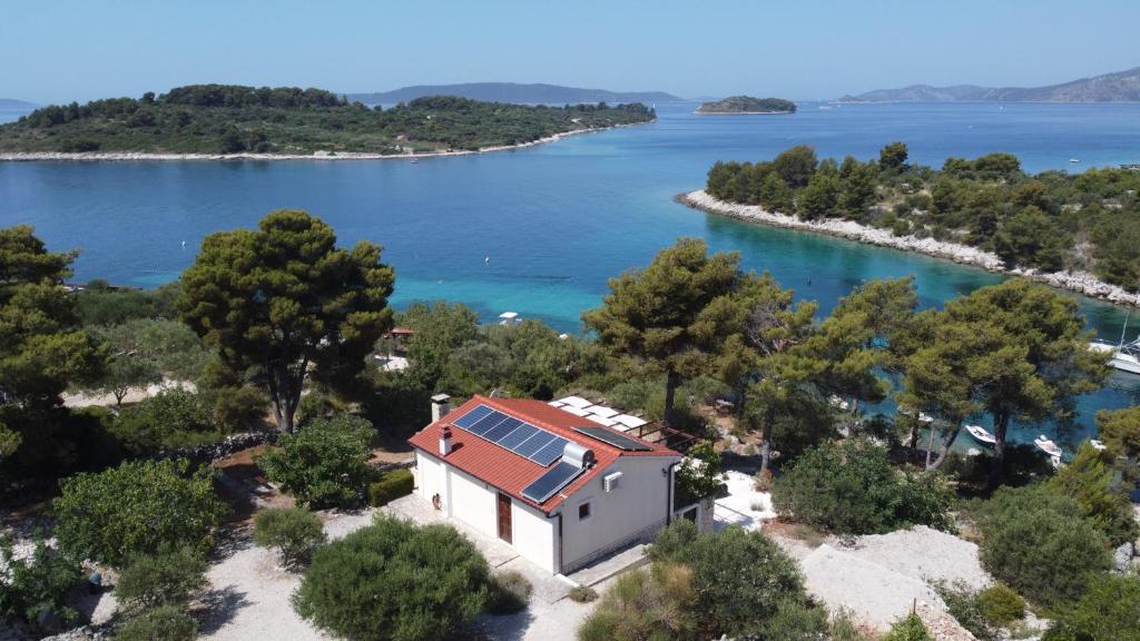an aerial view of a house on the shore of a lake at beautiful bay house Duga in Okrug Gornji