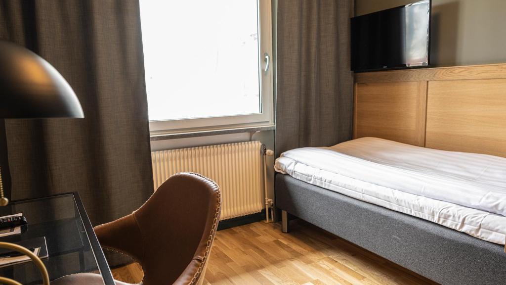 Postel nebo postele na pokoji v ubytování Lundsbrunn Resort & Spa