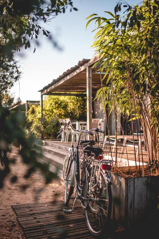 a bike parked in front of a house at Le Phare in Les Portes