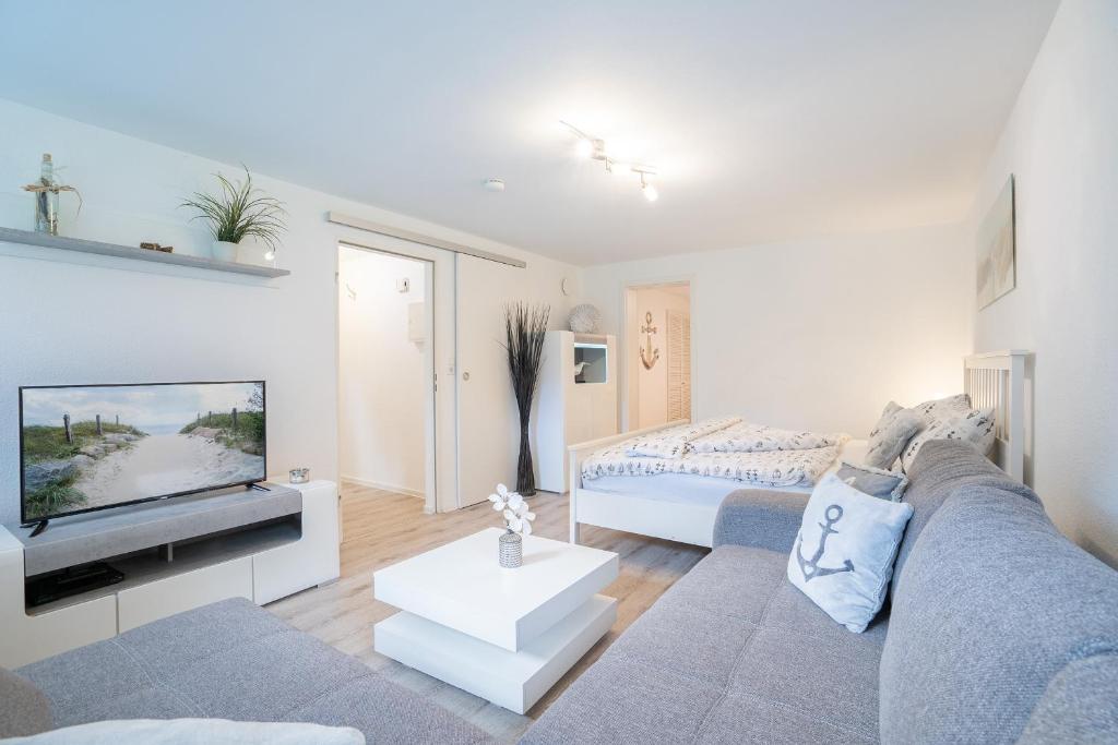 En eller flere senge i et værelse på MiBa Mare Ferienwohnung "Luna"