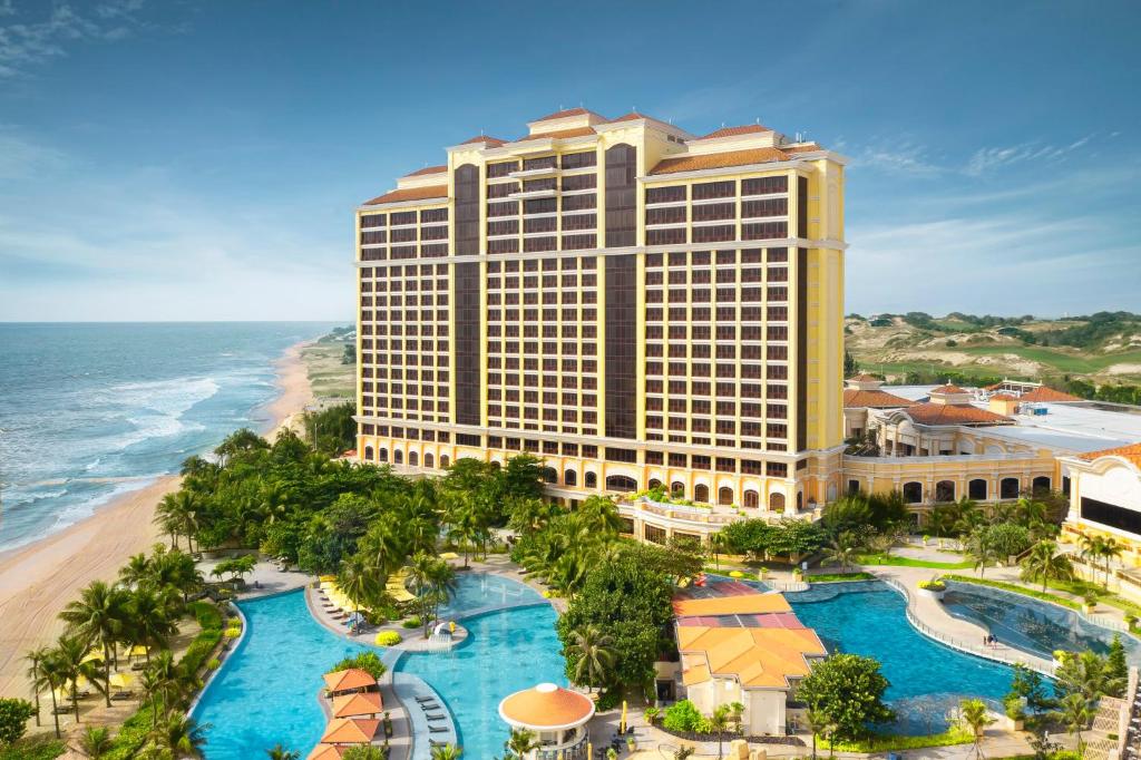 an aerial view of the mgm hotel and the beach at InterContinental Grand Ho Tram in Ho Tram