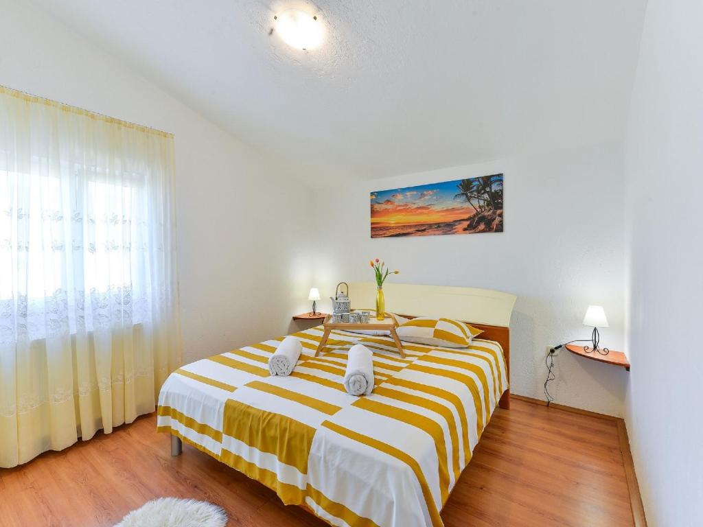 Posteľ alebo postele v izbe v ubytovaní Holiday House Marina with pool