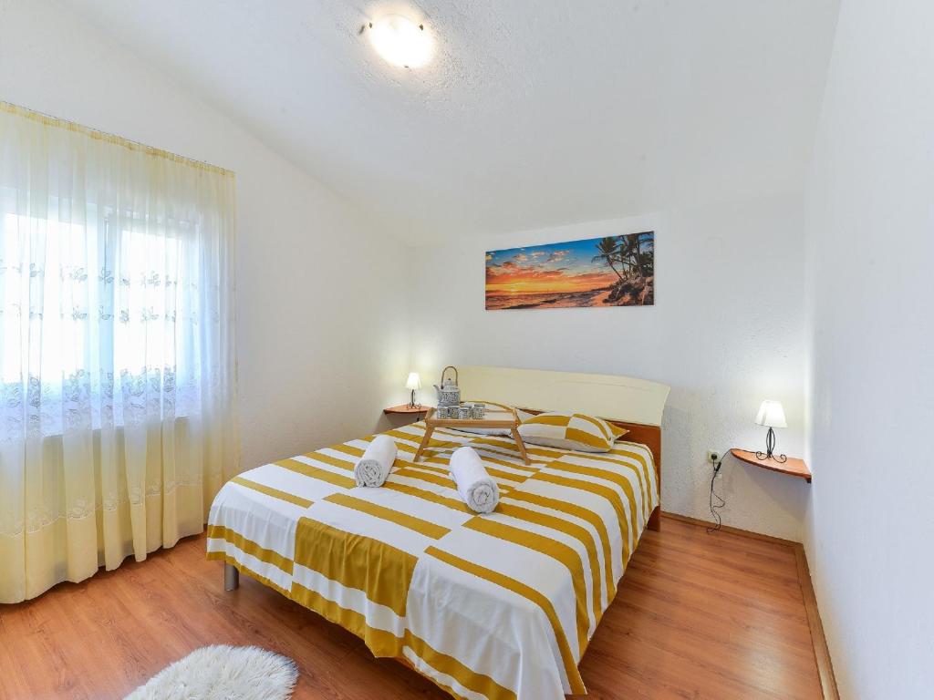 Posteľ alebo postele v izbe v ubytovaní Holiday House Marina with pool