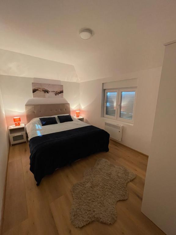 Ένα ή περισσότερα κρεβάτια σε δωμάτιο στο Carpe diem Zlatar