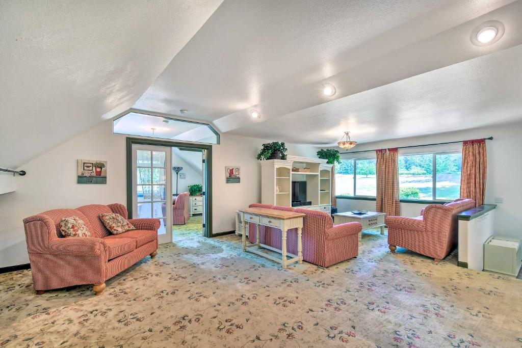 a living room with two chairs and a table at Exceptional Chehalis Retreat with Scenic Views! in Chehalis