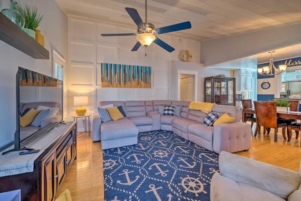 a living room with a couch and a tv at Peaceful Wilmington Home Near Beach and Downtown! in Carolina Beach