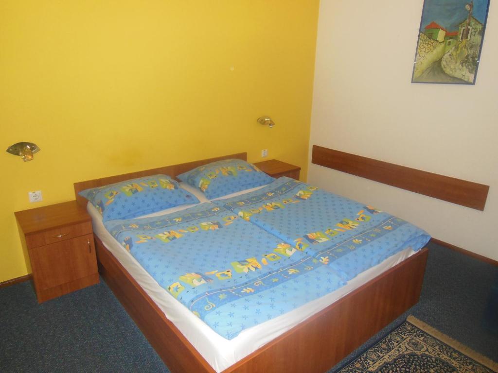 Postel nebo postele na pokoji v ubytování Hotel Pri Belokranjcu