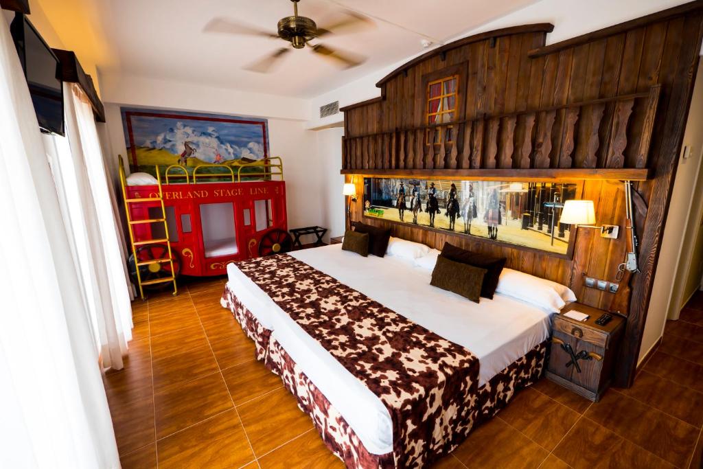 a bedroom with a large bed with a wooden headboard at Playadulce in Aguadulce