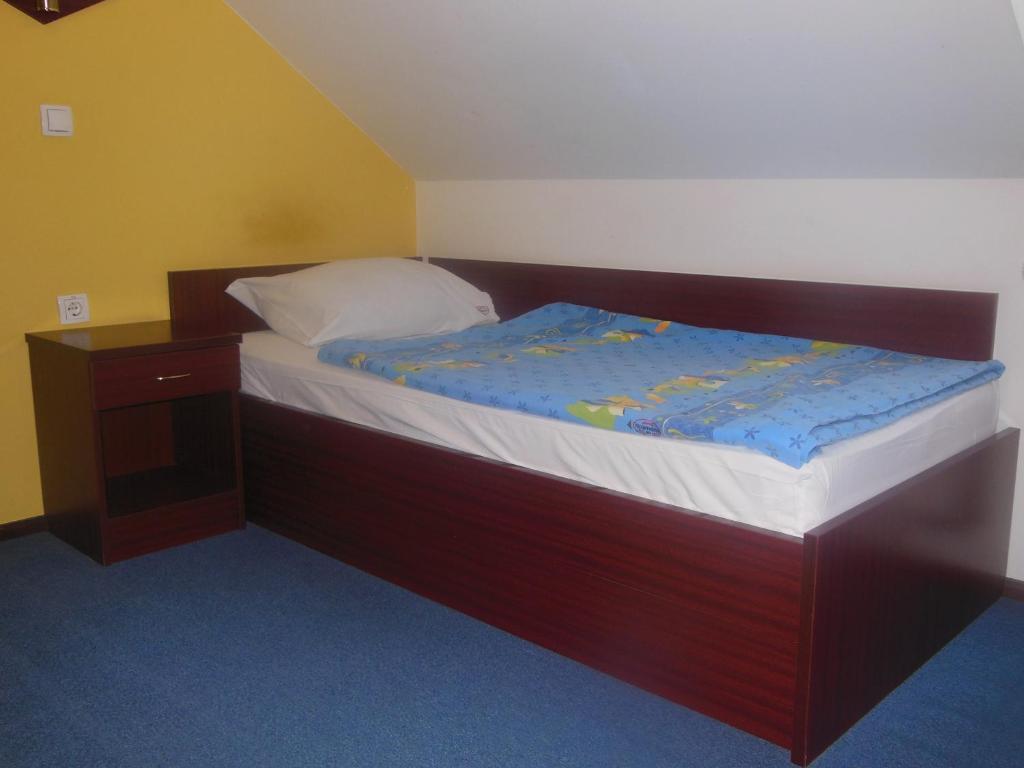 Postel nebo postele na pokoji v ubytování Hotel Pri Belokranjcu