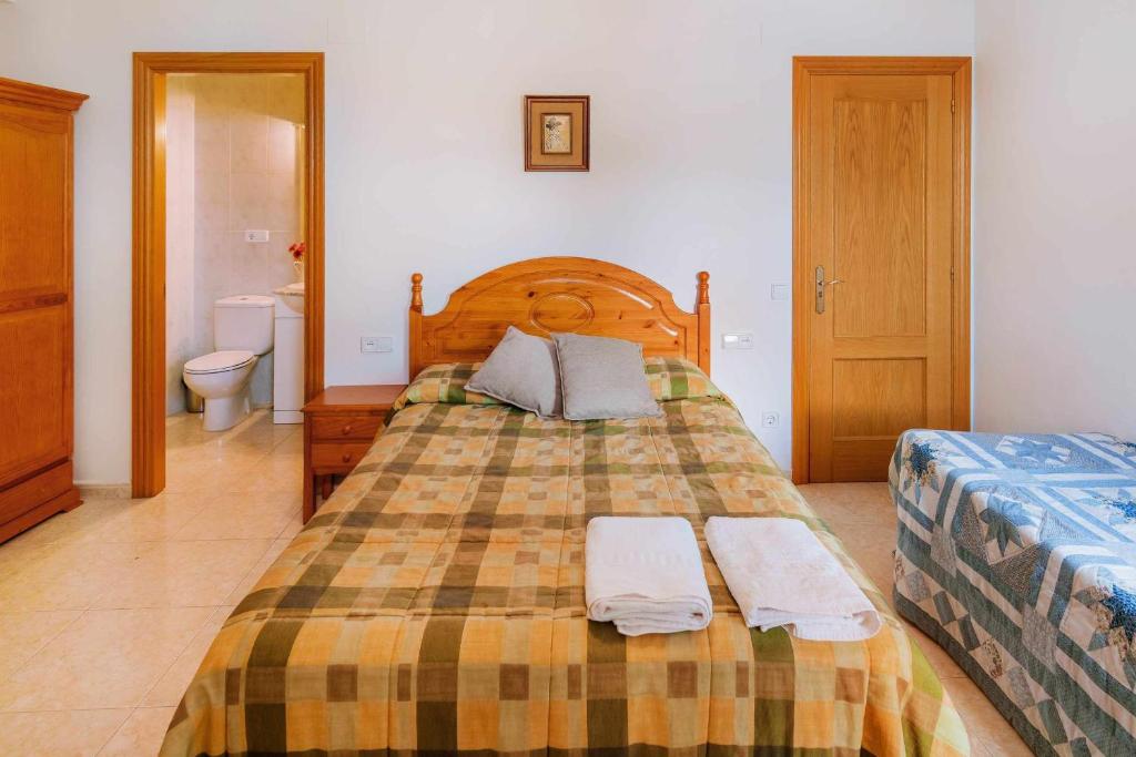 Postel nebo postele na pokoji v ubytování Casa Xaupí Gran