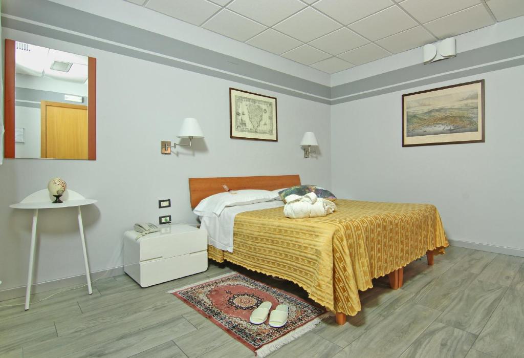 Säng eller sängar i ett rum på Albergo Al Viale