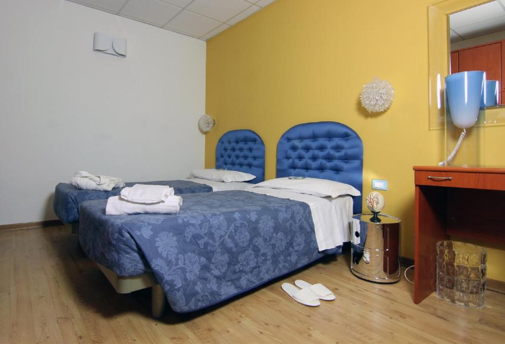 Postel nebo postele na pokoji v ubytování Albergo Al Viale