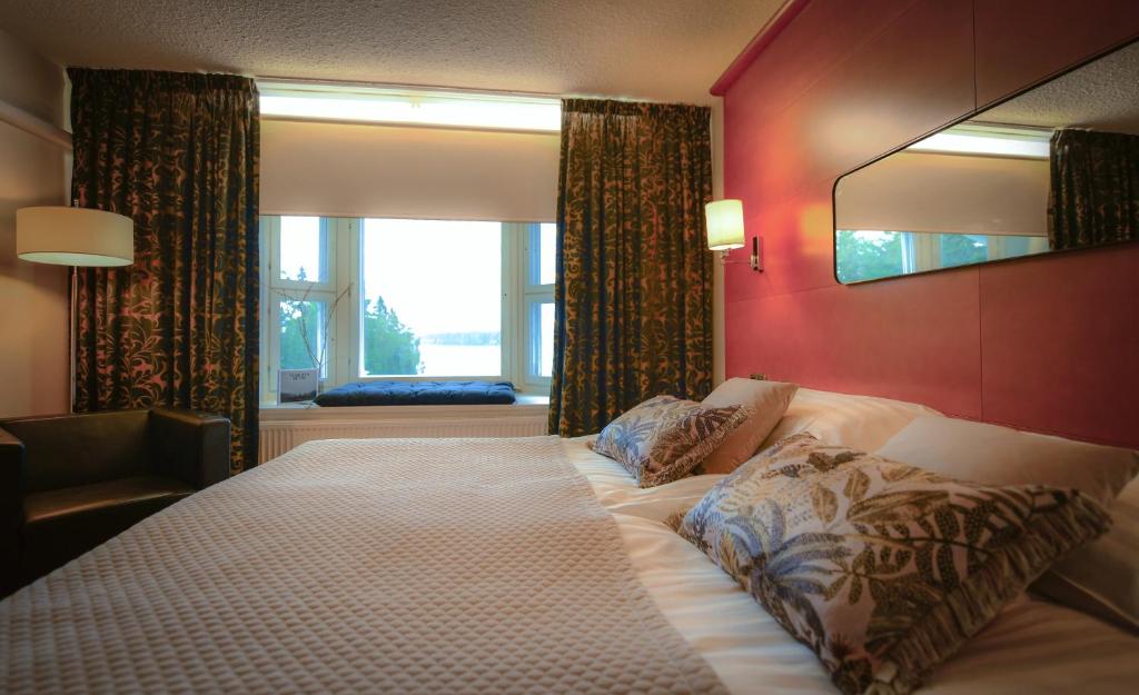 Кровать или кровати в номере Hotel Aateli Lakeside