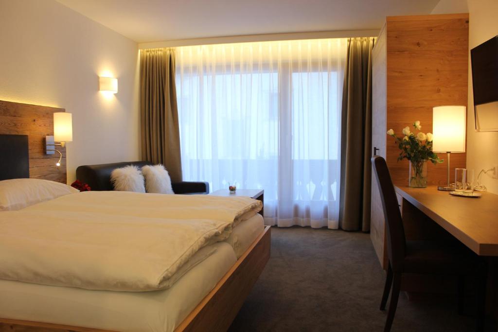 Postel nebo postele na pokoji v ubytování Waldpark Hotel Garni