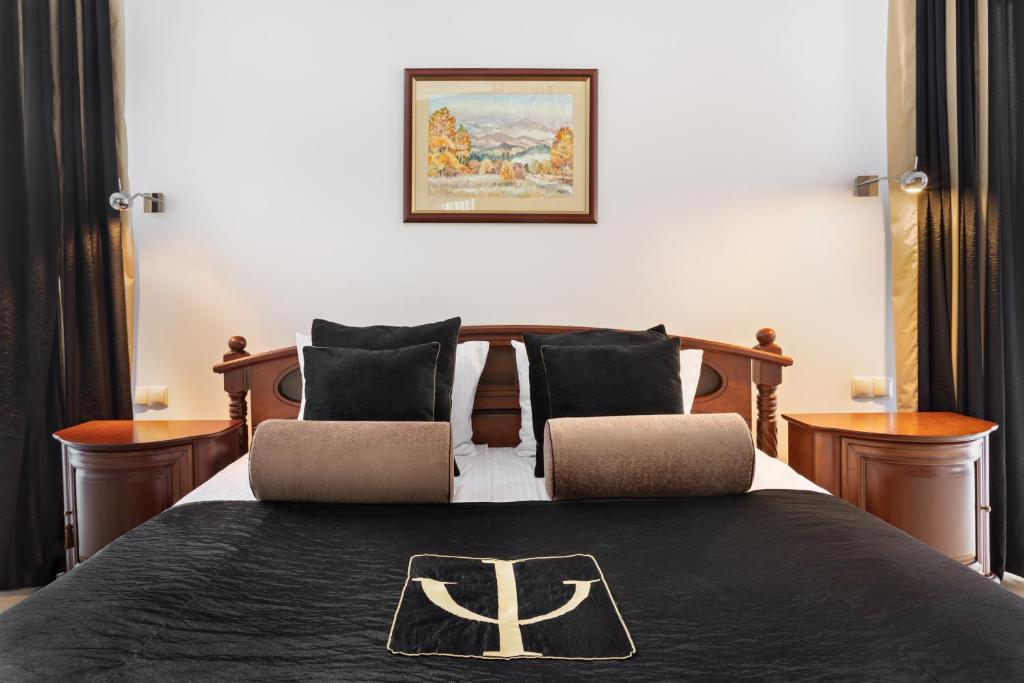 Postel nebo postele na pokoji v ubytování Hotel Olympic Spa & Wellness