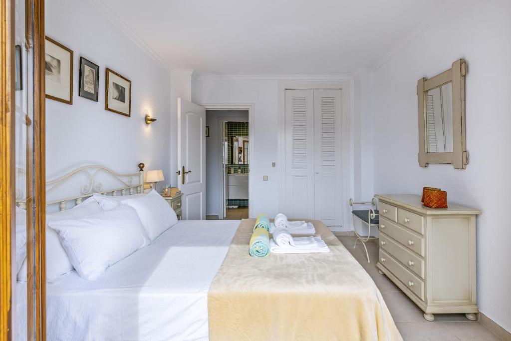 Postel nebo postele na pokoji v ubytování La Isla Penthouse