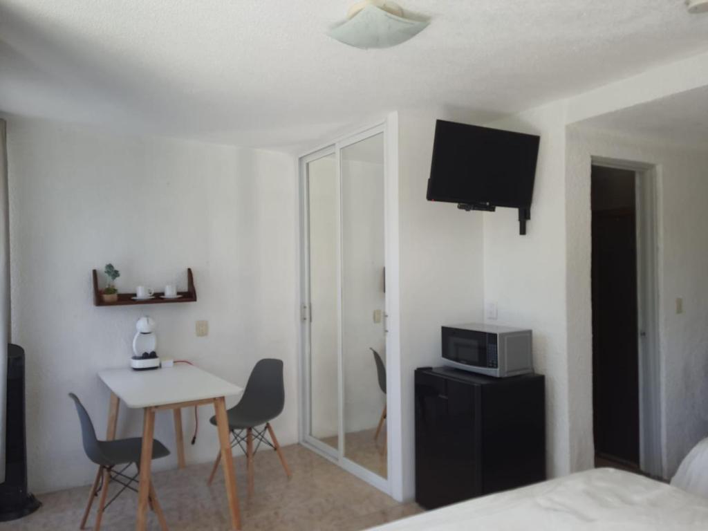 TV a/nebo společenská místnost v ubytování Hotel Posada Santa Fe