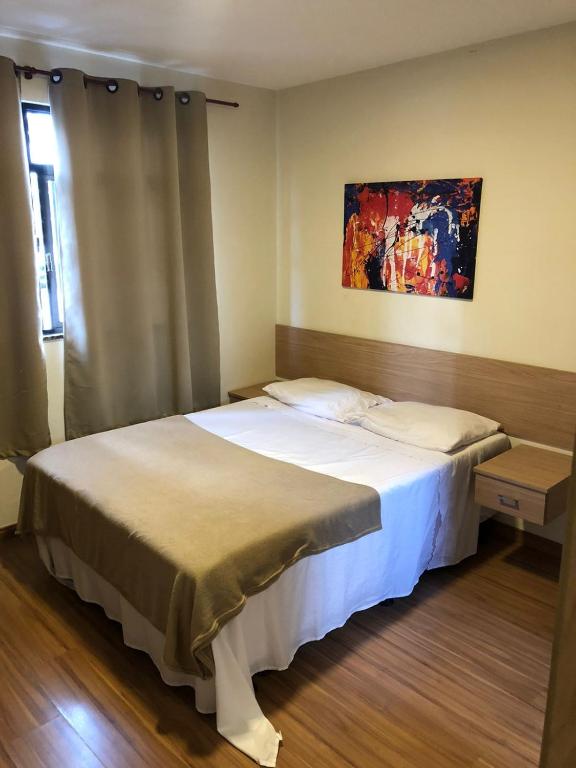 Cama ou camas em um quarto em Pousada HD