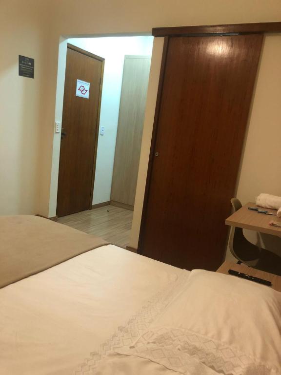 Cama ou camas em um quarto em Pousada HD