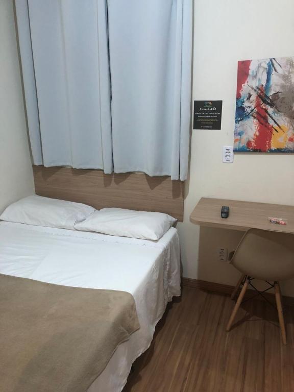 Cama ou camas em um quarto em Pousada HD