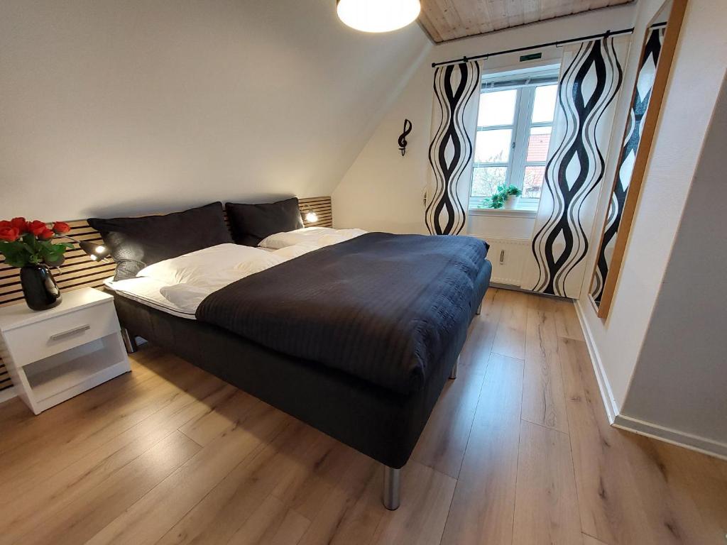 Postel nebo postele na pokoji v ubytování Toftegården Guesthouse - Apartments & Rooms