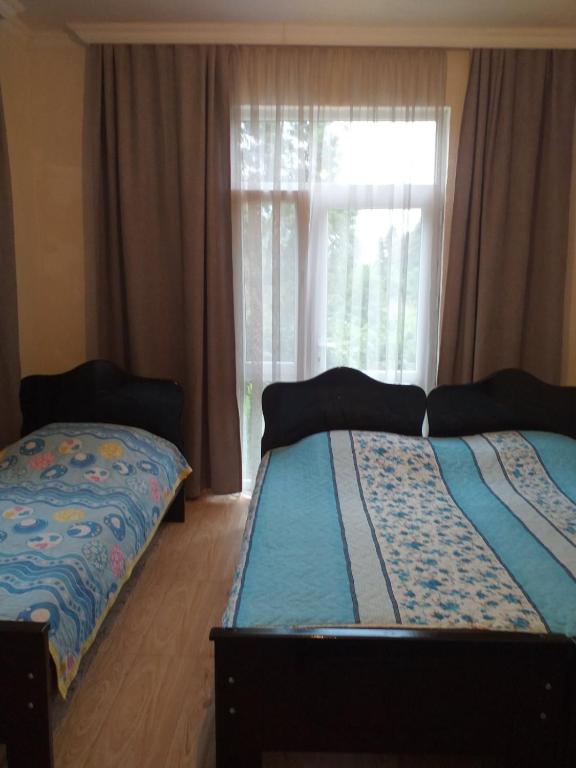 Postel nebo postele na pokoji v ubytování Family Hotel "Big House"