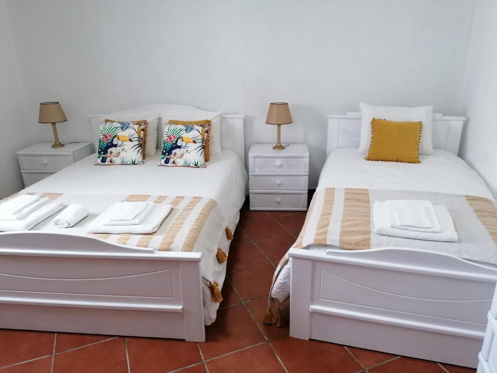 Katil atau katil-katil dalam bilik di A Casa da Carolina