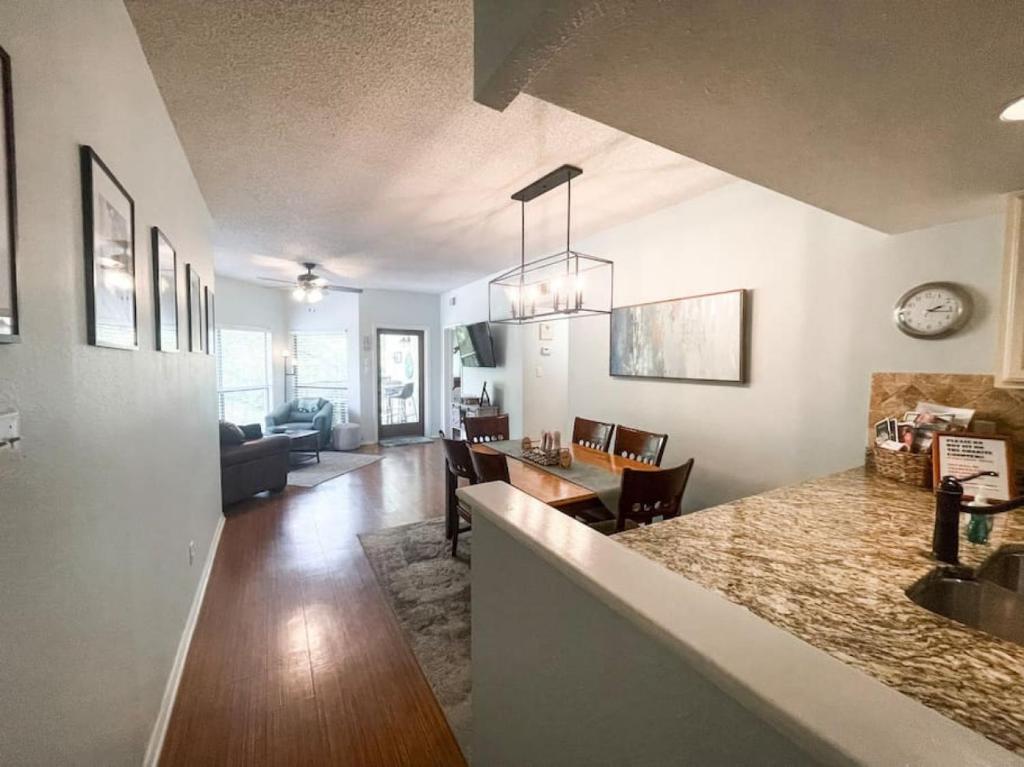 a kitchen and living room with a counter and a dining room at Our Happy Place in New Braunfels