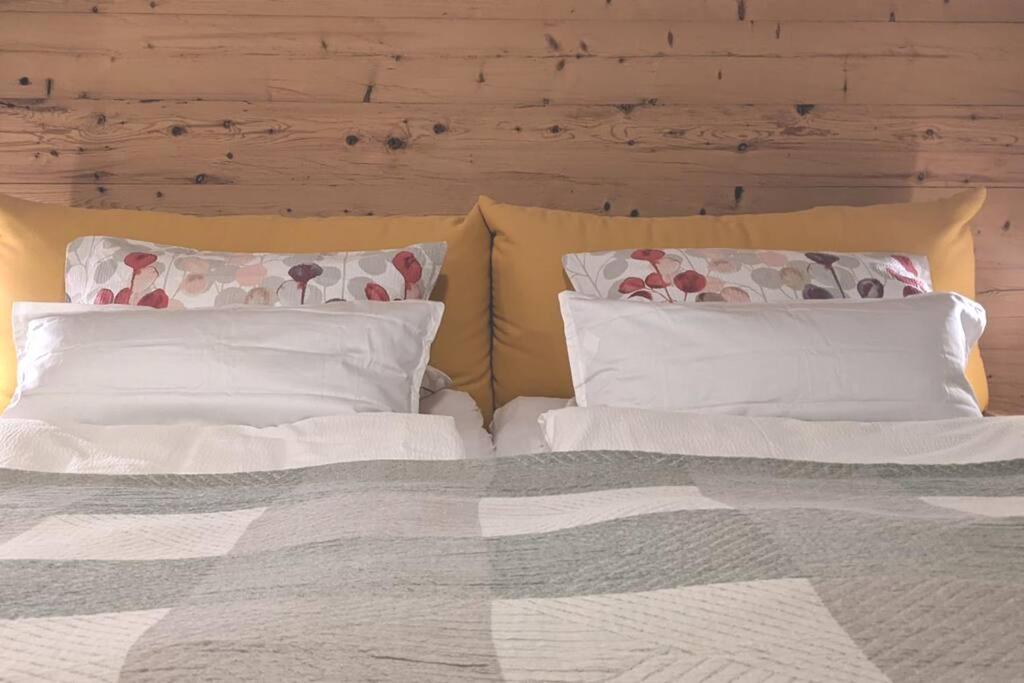 a bedroom with two pillows and a bed at Ferienwohnung in ruhiger Lage direkt am Wald in Heidenheim an der Brenz