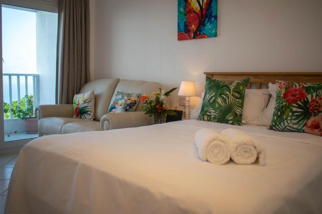 Postel nebo postele na pokoji v ubytování Morne SeaView Apartments