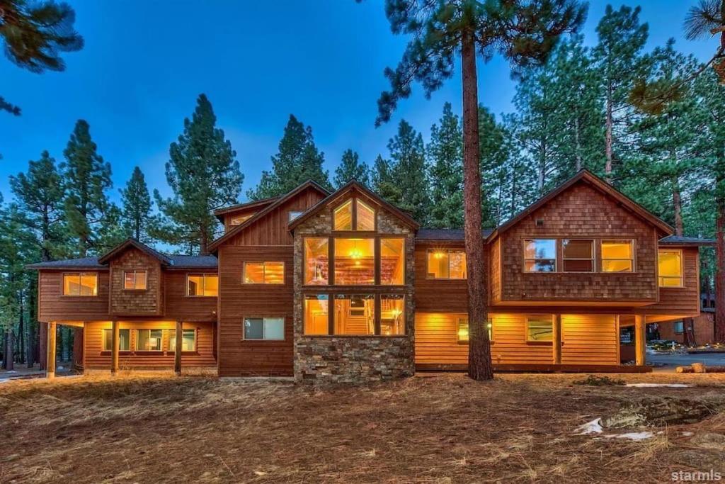 a home in the woods at night at Skier's Dream! Mansion Right Next to Heavenly in South Lake Tahoe