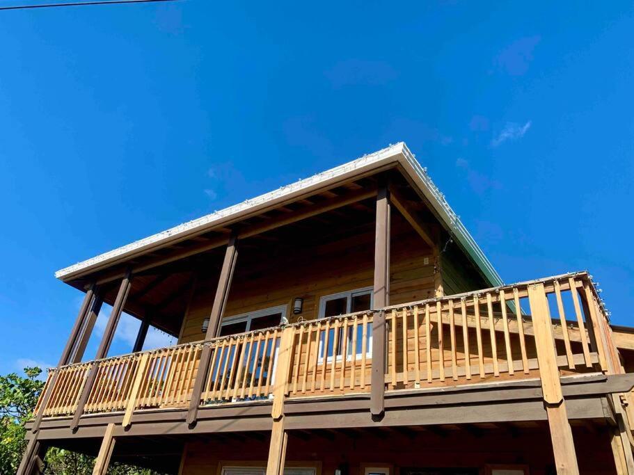 a house with a large deck on top of it at Lila loft- Private one floor bedroom &free parking in Roatan