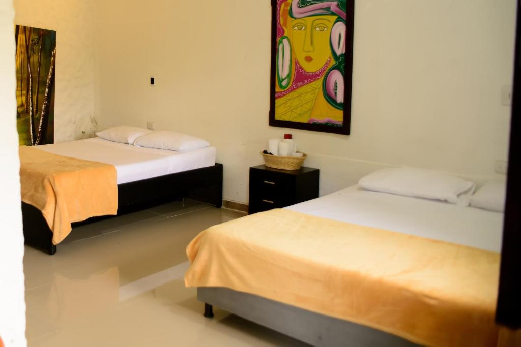 Postel nebo postele na pokoji v ubytování Finca Hotel Loma Verde