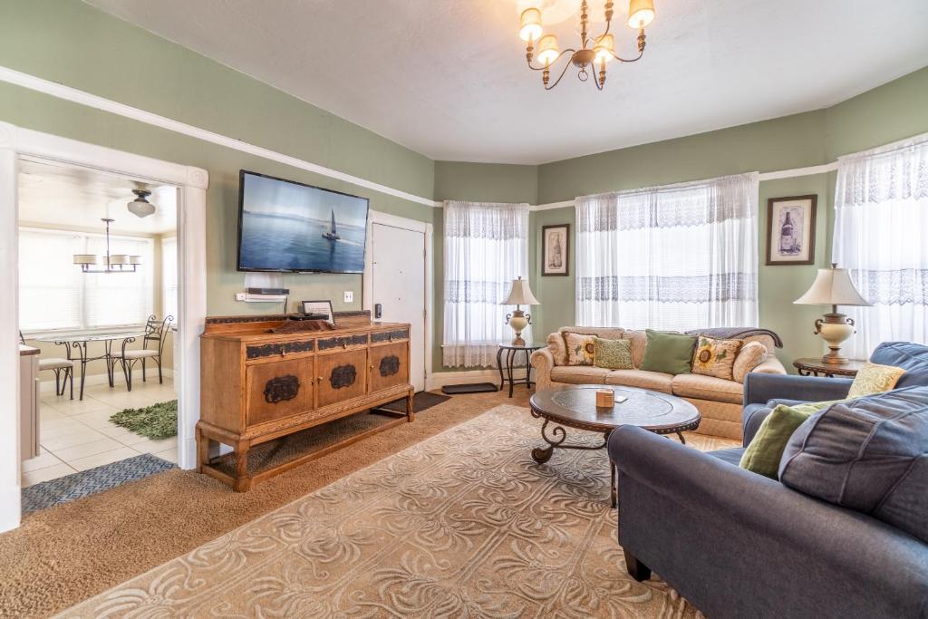 a living room with a couch and a tv at Rustic 2-Bedroom walking distance to Downtown in Reno