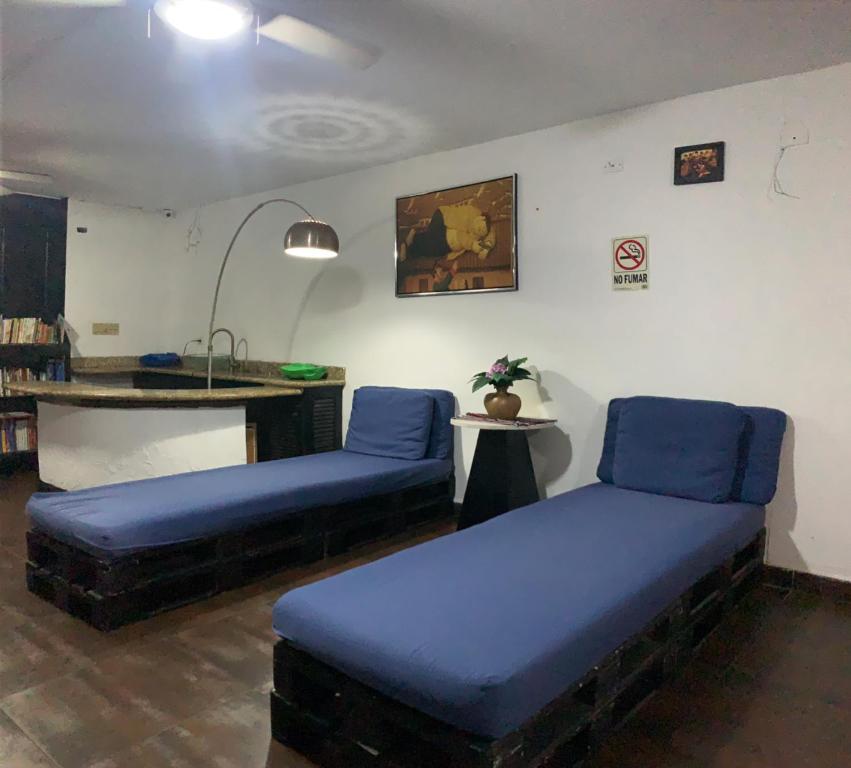 Letto o letti in una camera di Hostal Loco Coco Loco