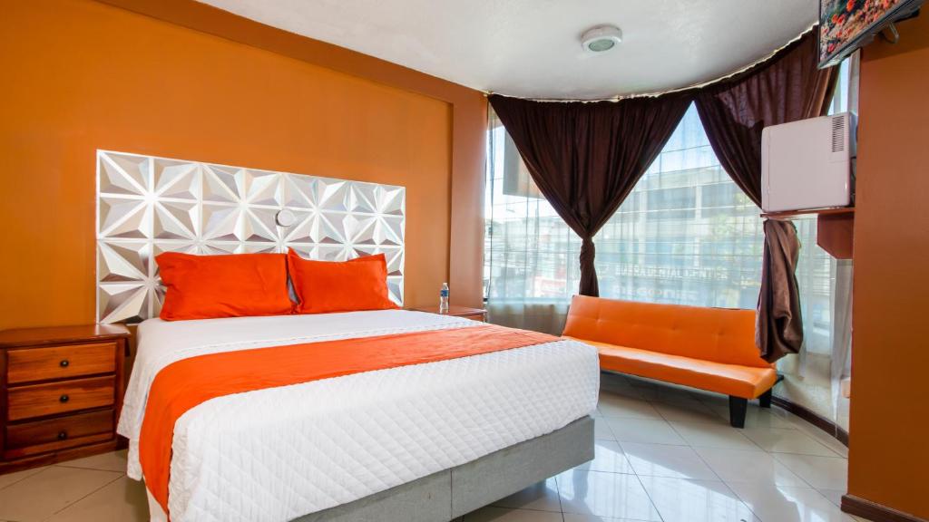 Postel nebo postele na pokoji v ubytování Hotel Miraflores