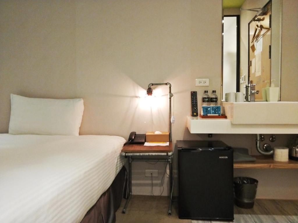 Postel nebo postele na pokoji v ubytování Cho Hotel