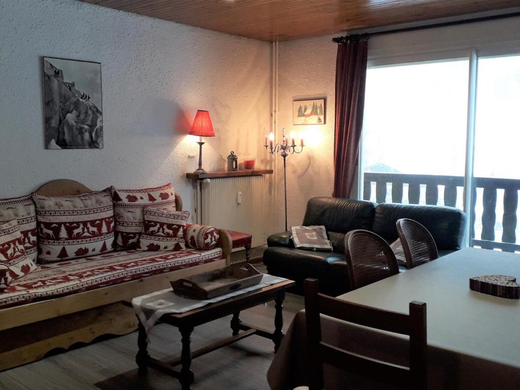 a living room with a couch and a table at Appartement Villard-de-Lans, 3 pièces, 6 personnes - FR-1-689-16 in Villard-de-Lans