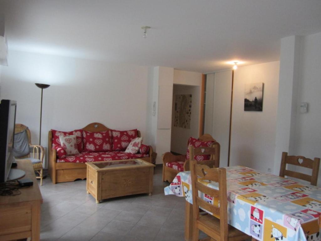 a living room with a couch and a table at Appartement Villard-de-Lans, 3 pièces, 6 personnes - FR-1-689-4 in Villard-de-Lans