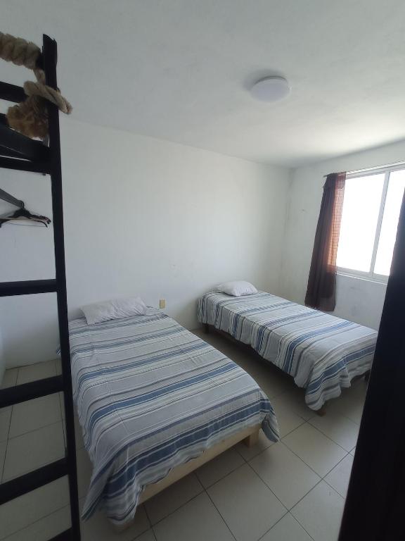 Letto o letti in una camera di Hotelito Ejido