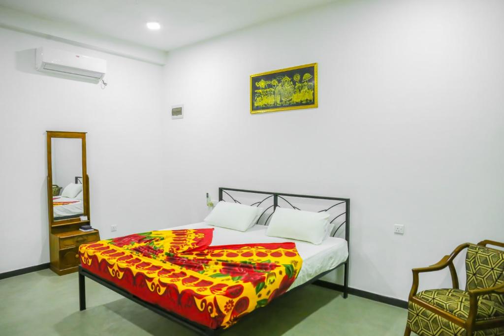 Postel nebo postele na pokoji v ubytování Sandy Palms Guesthouse