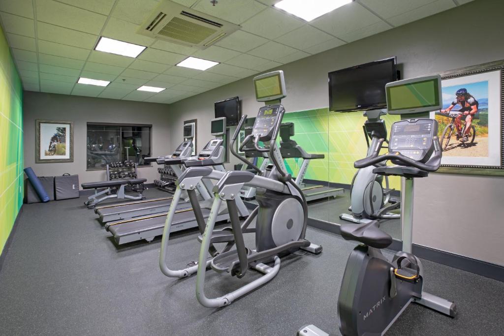 a gym with several treadmills and cardio machines at Holiday Inn & Suites Durango Downtown by IHG in Durango